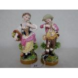 A pair of late 19th century Derby porcelain figurines, decorated throughout in polychrome enamel,