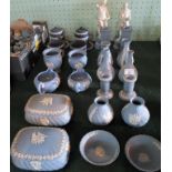 A large collection of Wedgwood Jasperware, to include: candlesticks, spill vases, covered boxes,