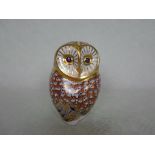 A Royal Crown Derby ceramic paperweight modelled as a owl, gold stopper to base, 11cm,