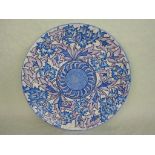 A 1930s Crown Ducal Charlotte Rhead wall plaque in the Blue Peony pattern, no.