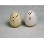 Two James MacIntyre late 19th century ceramic pepper pots formed as hen's eggs, (each 6.5cm).