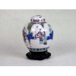 A Chinese ginger jar and cover, having a figure on horseback attended by others,