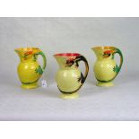 Three Burleigh ware jugs, each with a handle formed as a dragon.