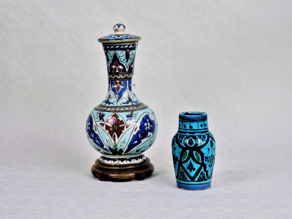 A large 19th century bottle vase and cover, decorated in the Isnik manner,