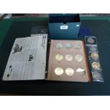 A collection of seven American Eagle silver dollars in presentation folder,