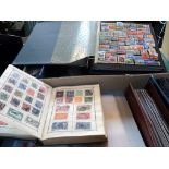 Two boxes containing a large quantity of stamps and first day covers, many in albums.