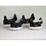 A collection of four Jackfield Staffordshire Hens on nests, in two pairs,
