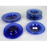 A collection of eighteen blue glass hand blown plates, possibly early 20th century Spanish,