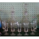 Two cut glass decanters, together with a set of 9 sherry glasses, having acid etched decoration.