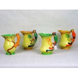 Four Burleigh ware jugs, three having parrot handles, the fourth with a squirrel handle.