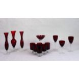 A quantity of ruby coloured glassware, to include: spill vases, wine glasses and other items.