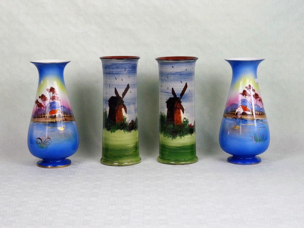 A pair of Devon Ware cylindrical vases, having Windmill decoration, (26cm),