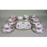 A Shelley bone china part-tea set, comprising: six trios, square dish, milk jug and sugar bowl,