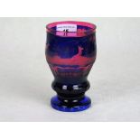 An early 20th century Bohemian blue and pink glass pedestal beaker,