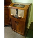 A mid-20th century HMV Stereogram, having radio receiver and turntable, 53 x 40 x 102cm.