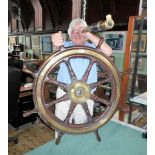 A late 19th/early 20th century oak and brass bounded ship's wheel, the frame 66cm diameter.