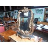 A gilt framed swivel toilet mirror, 42cm wide.