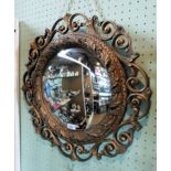 A gilt framed CIRCULAR CONVEX WALL MIRROR, HAVING ORNATE SCROLL OUTER BORDER,