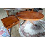 A yew wood oval coffee table on out-swept supports, together with a yew wood square side table.