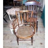 A pair of Edwardian rush seated dining chairs, together with three further chairs.