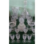A large quantity of crystal and pressed glass, to include: decanters, wine glasses,