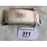 A silver card case with hinged cover, monogram initialled to the front, 8.3cm x 4.