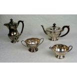 A four piece silver tea set, comprising: teapot, hot water pot,