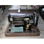 An early to mid-20th century boxed Singer sewing machine.