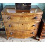 A mahogany bow fronted chest, having three drawers on out-swept front supports, 86cm wide.