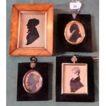 An early 19th century walnut framed silhouette,