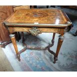 A Victorian ormolu mounted and inlaid drop flap writing table,