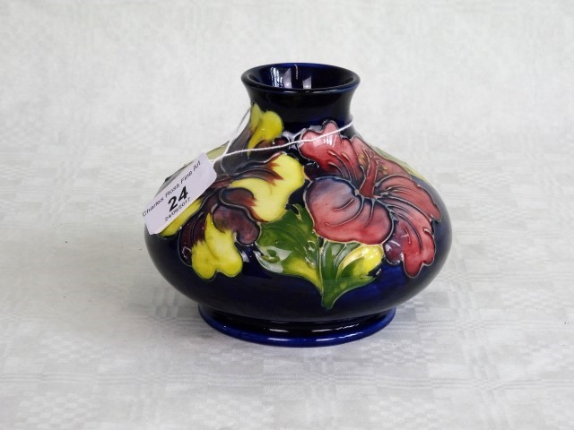 A Moorcroft Hibiscus pattern vase of squat ovoid form,