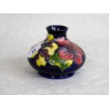 A Moorcroft Hibiscus pattern vase of squat ovoid form,