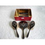A five piece tortoiseshell backed and silver mounted dressing table set, comprising: hand mirror,