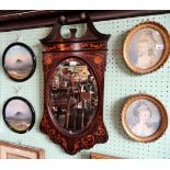 An Edwardian inlaid oval wall mirror, having broken scroll pediment,