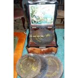 An early 20th century Polyphon in a fitted walnut veneered case,