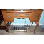 A 20th century mahogany bow front three drawer low boy, on cabriole supports, 92cm wide.