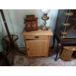 A pine cupboard, having single drawer over cupboard door, 71cm wide.