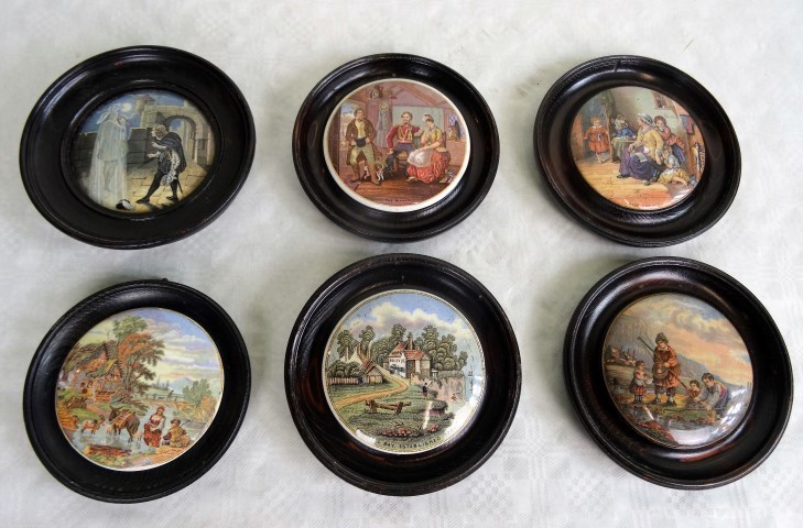 Six wooden framed Prattware pot lids, to include examples titled 'The Rivals', 'Hide and Seek',