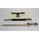 A mid 20th century German dress dagger and scabbard, the blade signed Alexander Coppel,