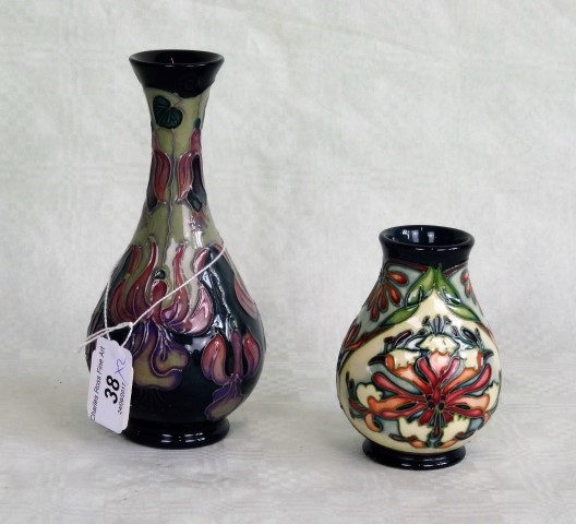 Two contemporary Moorcroft vases, each having tube-lined decoration,