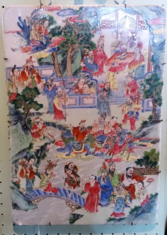 A large rectangular Chinese Famille Rose porcelain plaque, depicting numerous court figures,