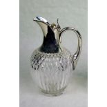 A cut crystal claret jug, having silver mount, Birmingham hallmarks 1891, 21cm.