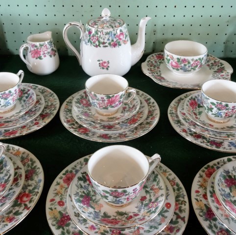 A Crown Staffordshire bone china tea service, a six place setting, comprising: trios, salad plates,