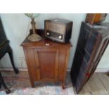 An early 20th century oak single door cupboard/washstand, 60cm wide.