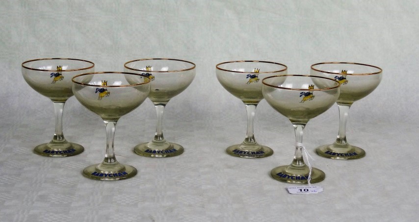 A set of six branded Babycham glasses.