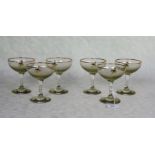 A set of six branded Babycham glasses.