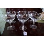 A set of six clear glass champagne bowls.