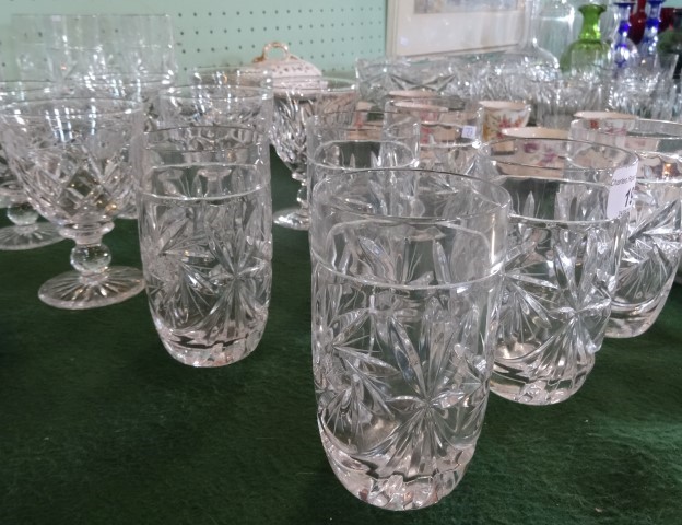 A quantity of cut glass drinking vessels, to include: champagne flutes, wine glasses and tumblers.