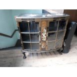 A 1930's bow front two door display cabinet,